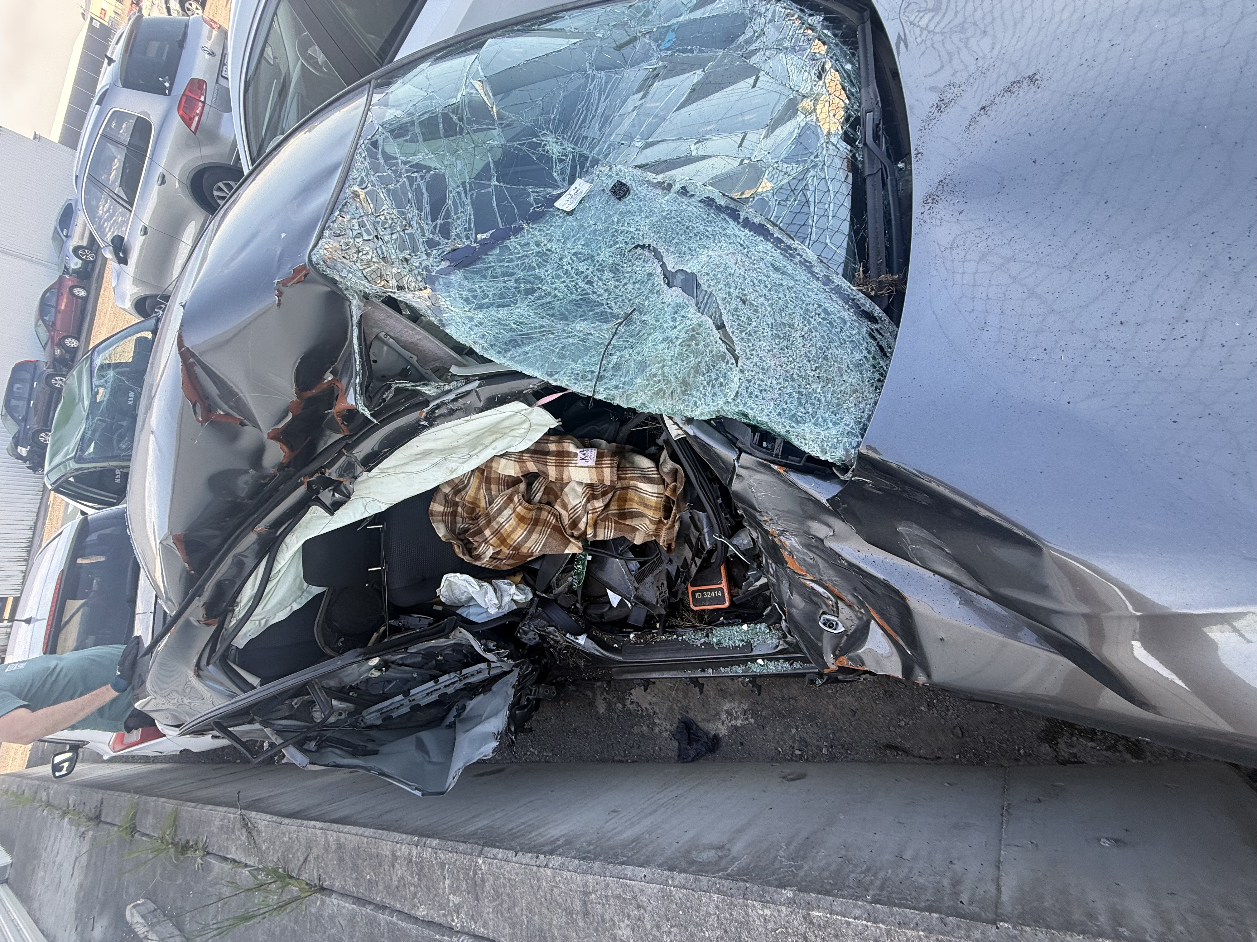 A car crushed on the drivers side.